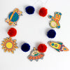 Kids completed Outer Space Garland - finished - colored and strung with pom poms.  Great for kids 4+ background