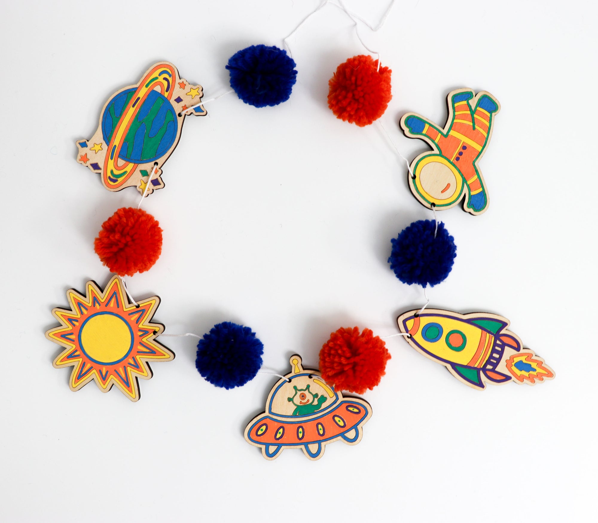 Kids completed Outer Space Garland - finished - colored and strung with pom poms.  Great for kids 4+ background
